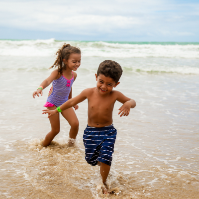 Travelling With Children blog. Children playing in sea